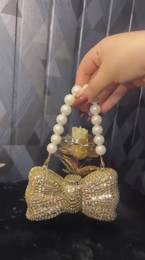 Kundan Bow Clutch with Pearl Handle